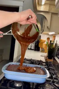 Pouring the icing on the Chocolate Cherry Cake